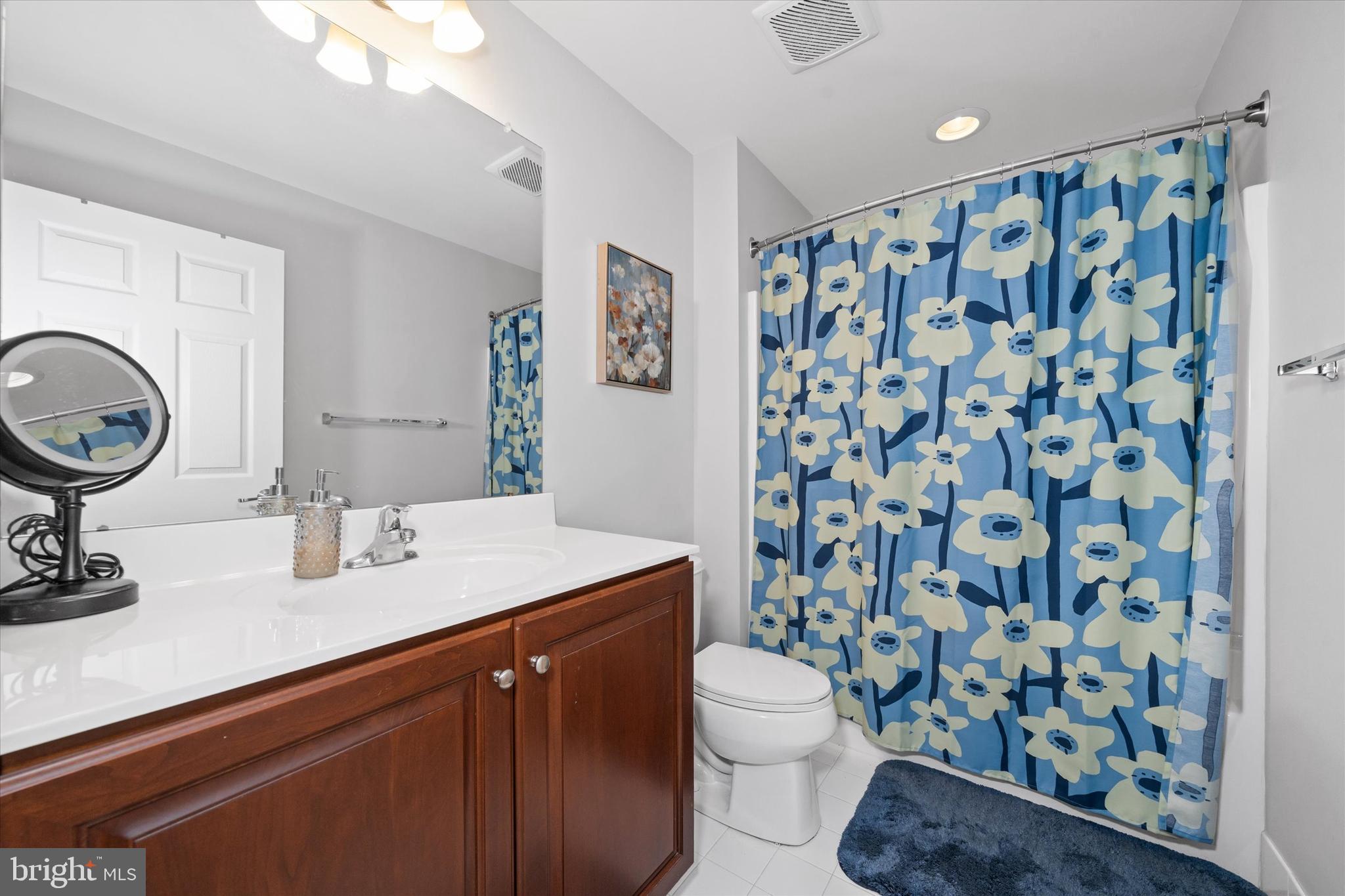 264 Deepdale Drive, Unit 31 Kennett Square, PA 19348 - Photo 13 of 34 a bathroom with a sink toilet and shower