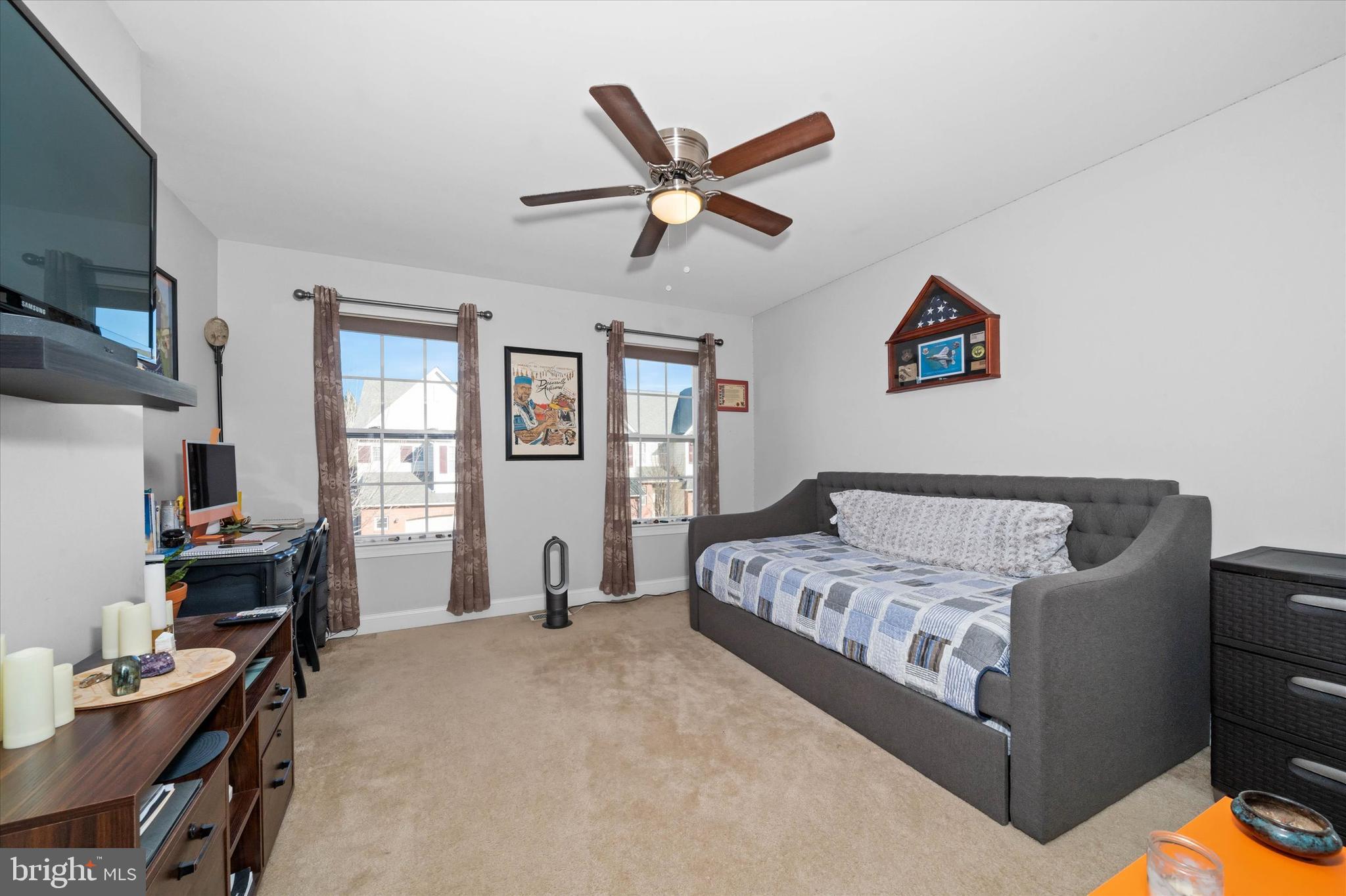 264 Deepdale Drive, Unit 31 Kennett Square, PA 19348 - Photo 15 of 34 a bed room with a bed and a window