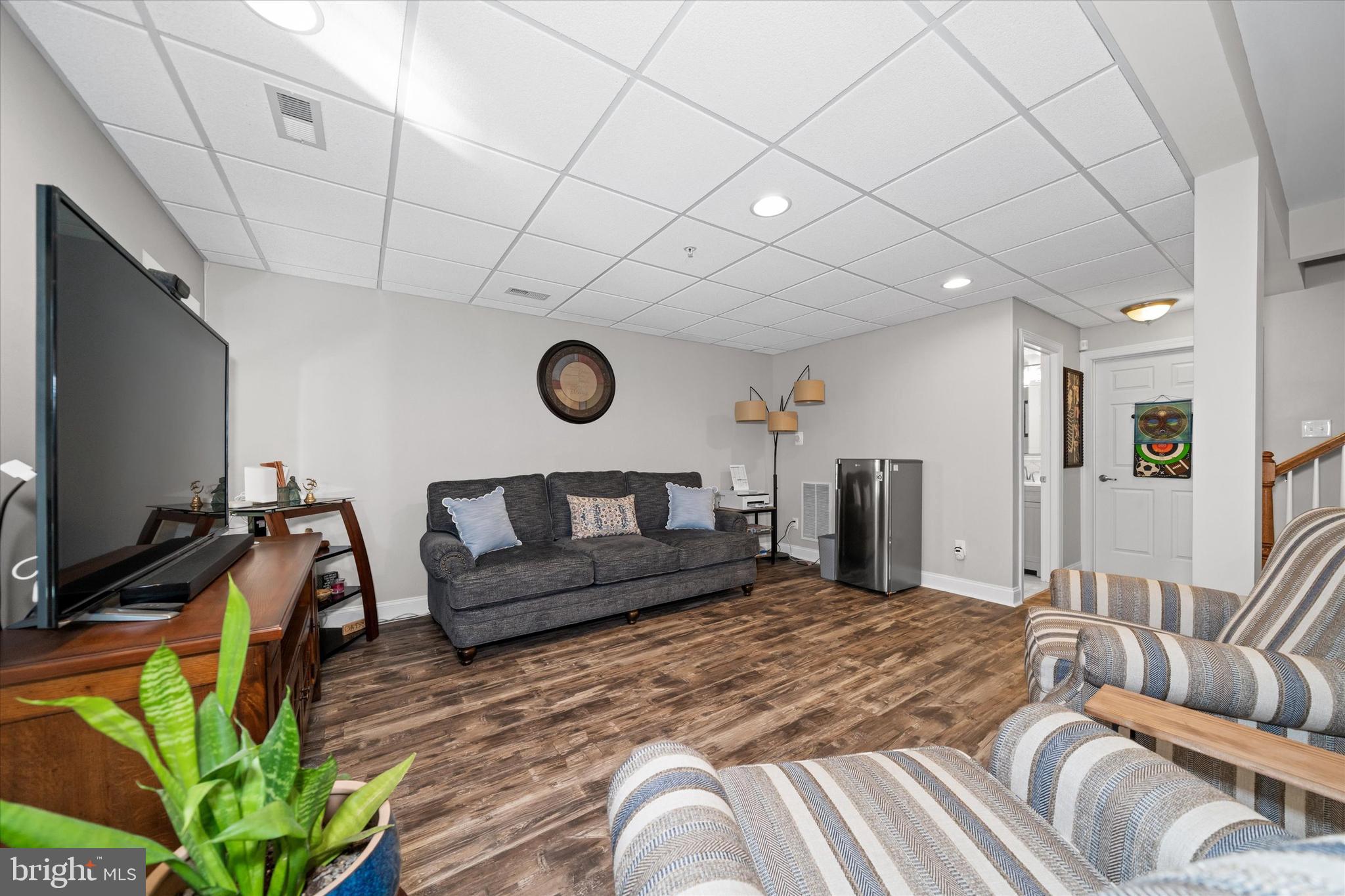 264 Deepdale Drive, Unit 31 Kennett Square, PA 19348 - Photo 19 of 34 a bedroom with furniture and a flat screen tv