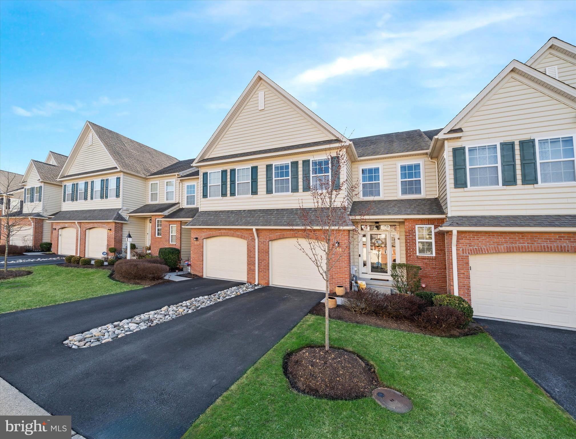 264 Deepdale Drive, Unit 31 Kennett Square, PA 19348 - Photo 2 of 34 a front view of a house with a yard