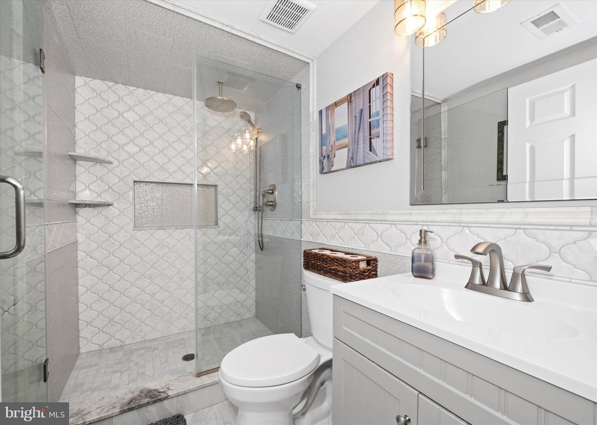 264 Deepdale Drive, Unit 31 Kennett Square, PA 19348 - Photo 21 of 34 a bathroom with a sink a toilet and shower