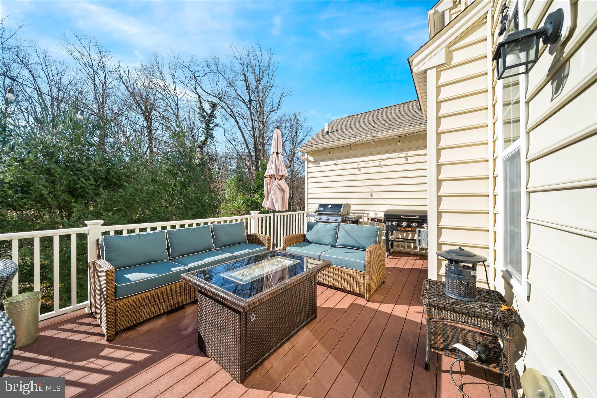 264 Deepdale Drive, Unit 31 Kennett Square, PA 19348 - Photo 22 of 34 a roof deck with couches and wooden floor