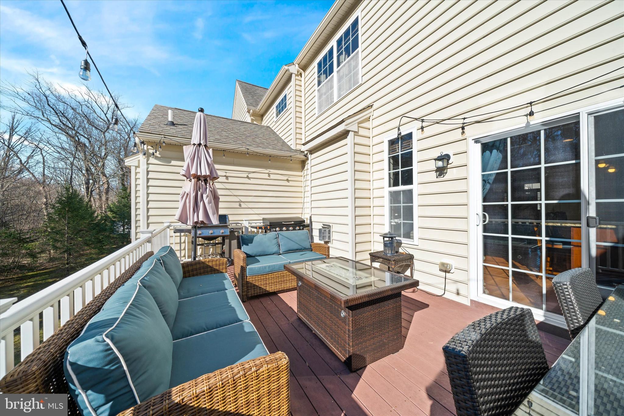 264 Deepdale Drive, Unit 31 Kennett Square, PA 19348 - Photo 23 of 34 a view of a patio with couches chairs and wooden floor