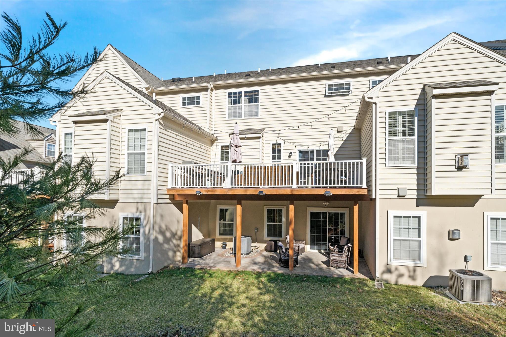 264 Deepdale Drive, Unit 31 Kennett Square, PA 19348 - Photo 30 of 34 a view of a house with a yard and sitting area