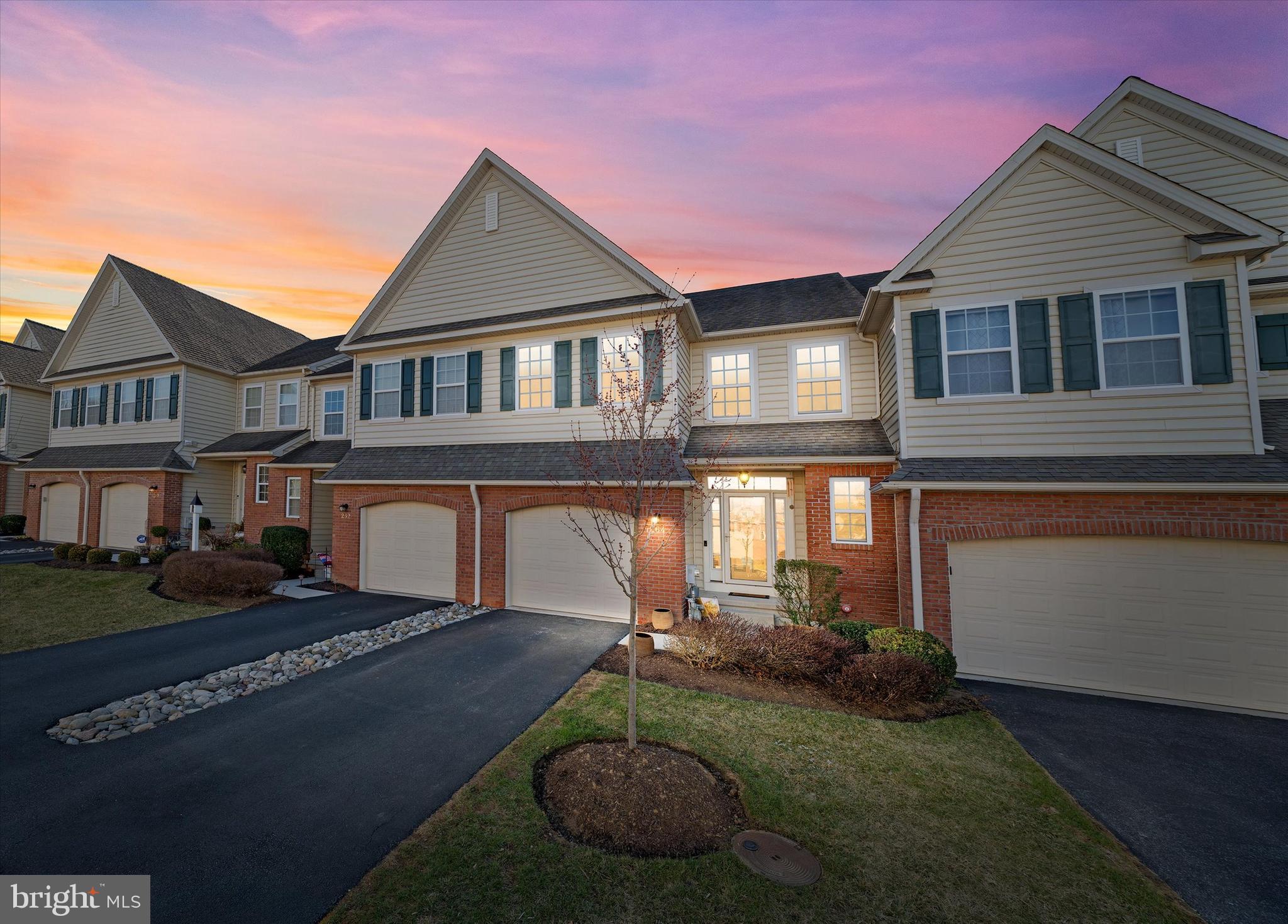 264 Deepdale Drive, Unit 31 Kennett Square, PA 19348 - Photo 31 of 34 a front view of a house with a yard and garage