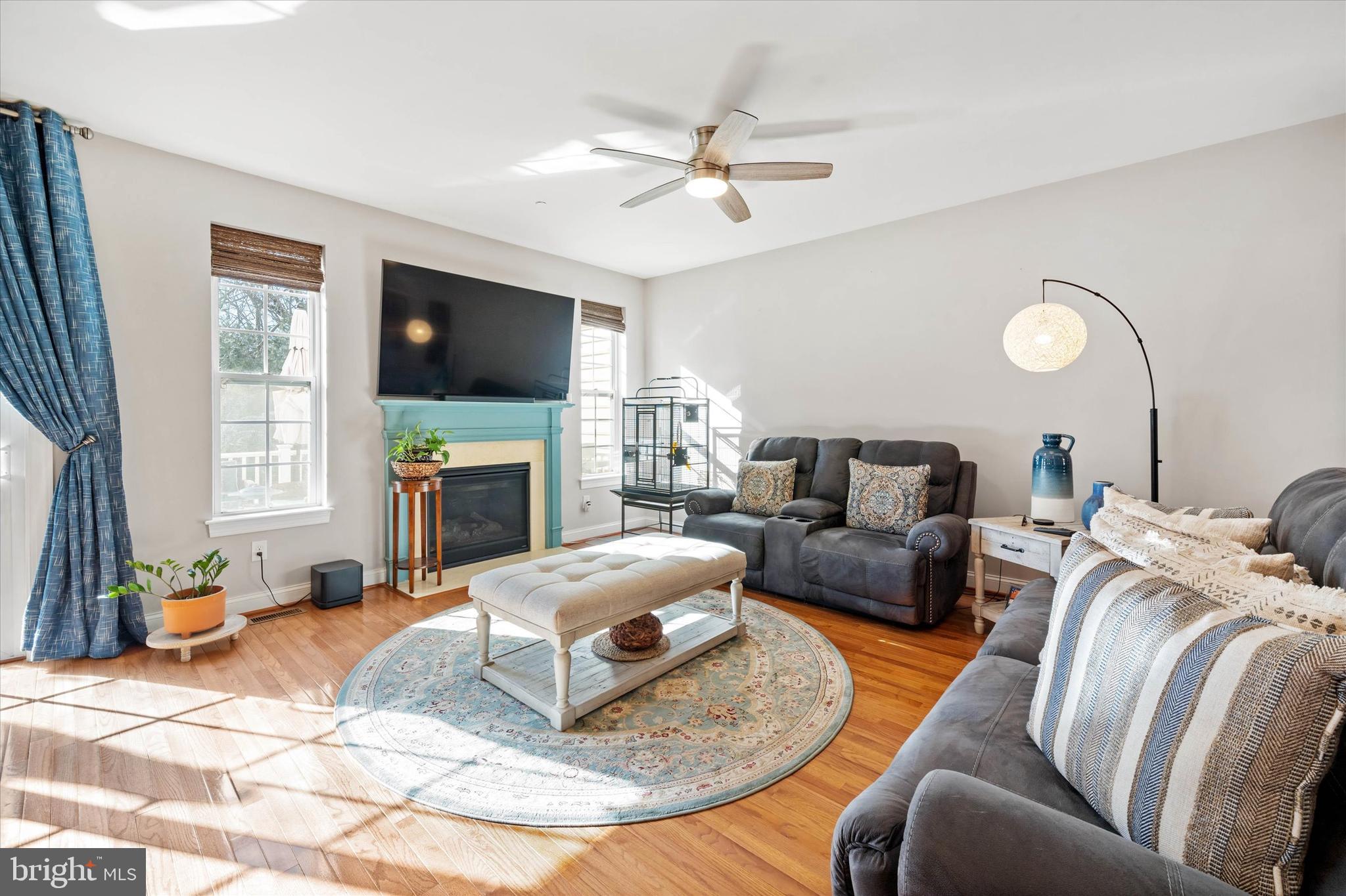 264 Deepdale Drive, Unit 31 Kennett Square, PA 19348 - Photo 5 of 34 a living room with furniture a fireplace and a flat screen tv