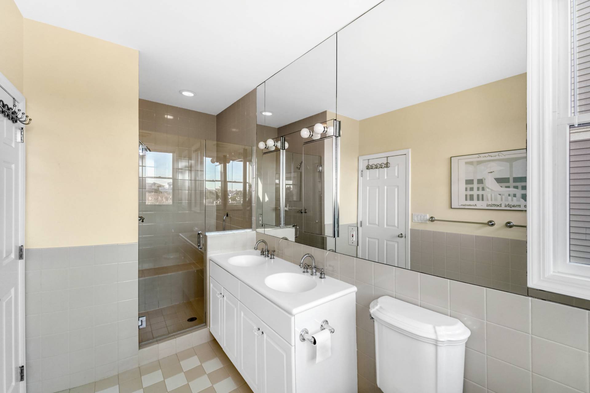 580 Dune Road, Unit 3 Westhampton Beach, NY 11978 - Photo 12 of 19 a bathroom with a sink a toilet and shower