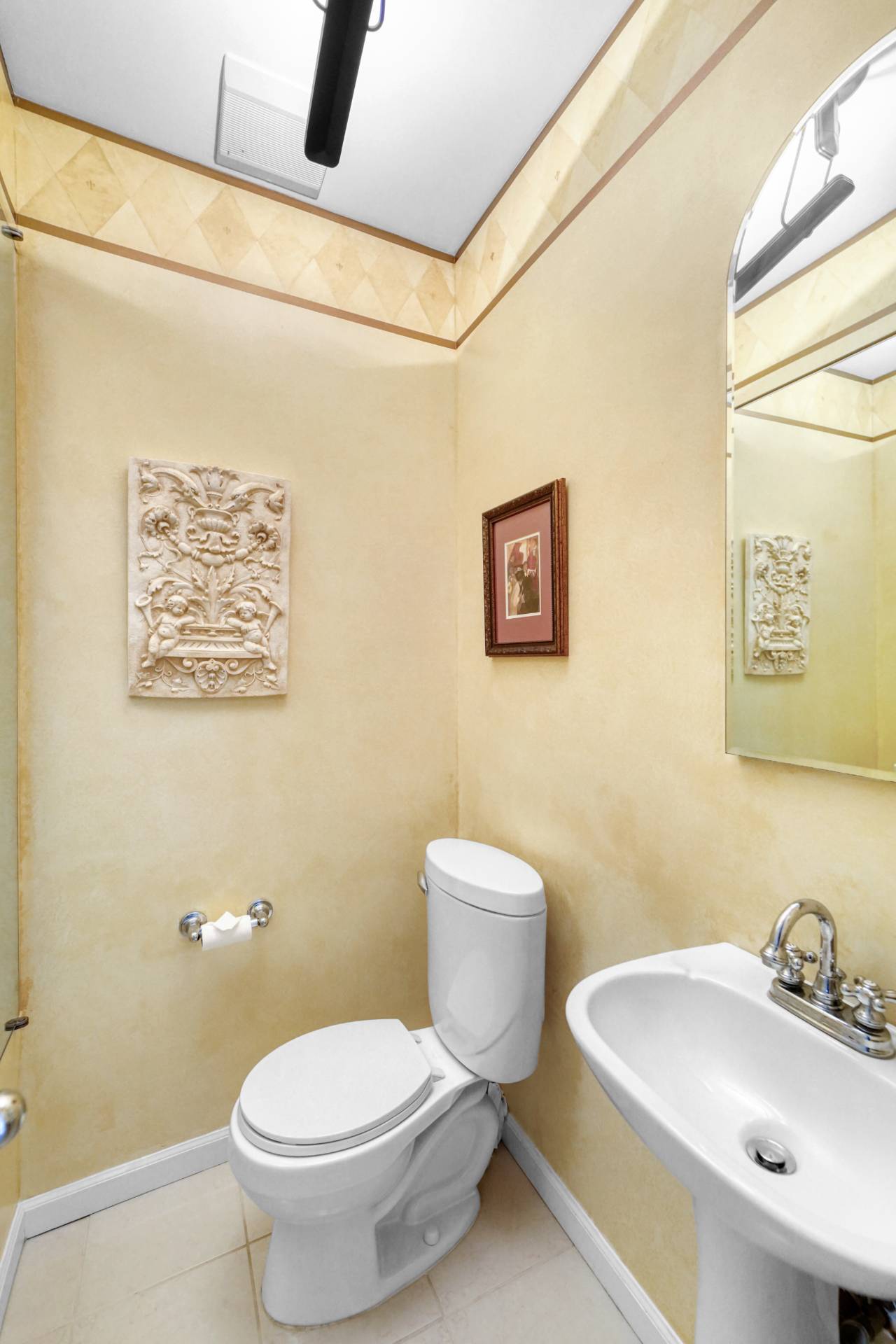 580 Dune Road, Unit 3 Westhampton Beach, NY 11978 - Photo 16 of 19 a bathroom with a toilet sink and mirror