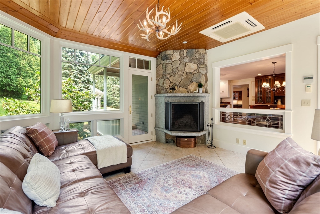 32 Intervale Road Weston, MA 02493 - Photo 12 of 42 a living room with furniture and a fireplace