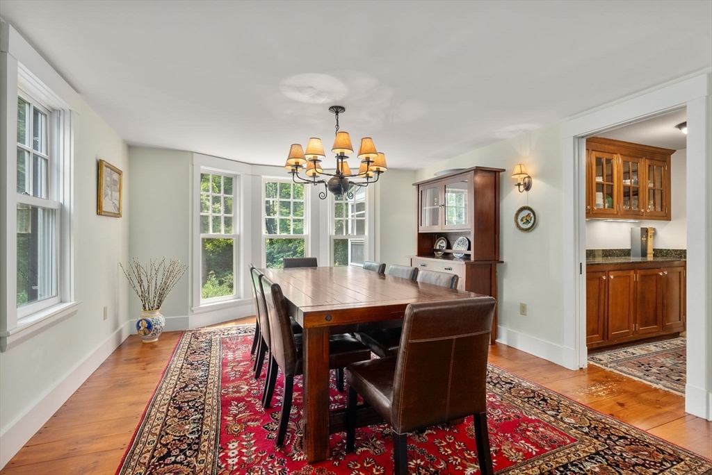 32 Intervale Road Weston, MA 02493 - Photo 17 of 42 a view of a dining room with furniture window and wooden floor