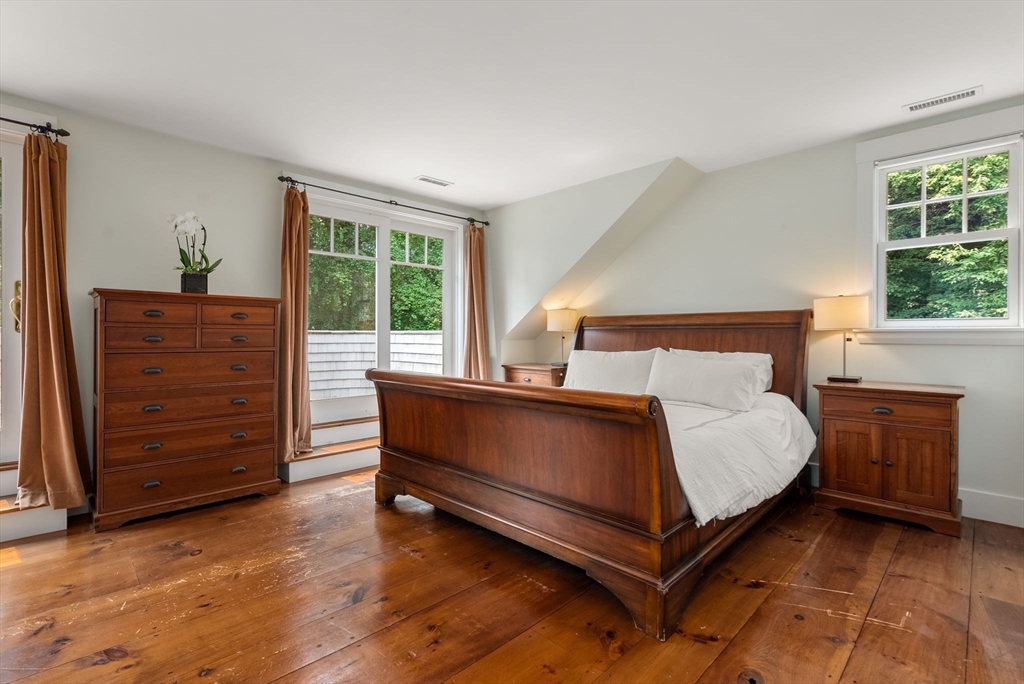 32 Intervale Road Weston, MA 02493 - Photo 21 of 42 a bed sitting in a bedroom next to a window