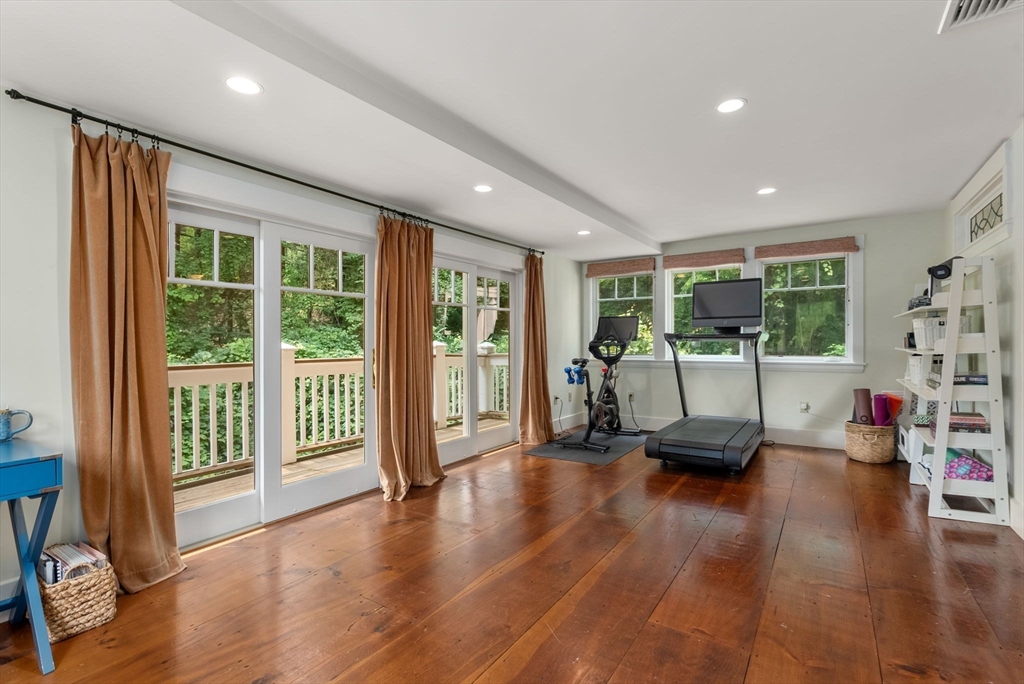 32 Intervale Road Weston, MA 02493 - Photo 29 of 42 a living room with furniture floor to ceiling window and wooden floor