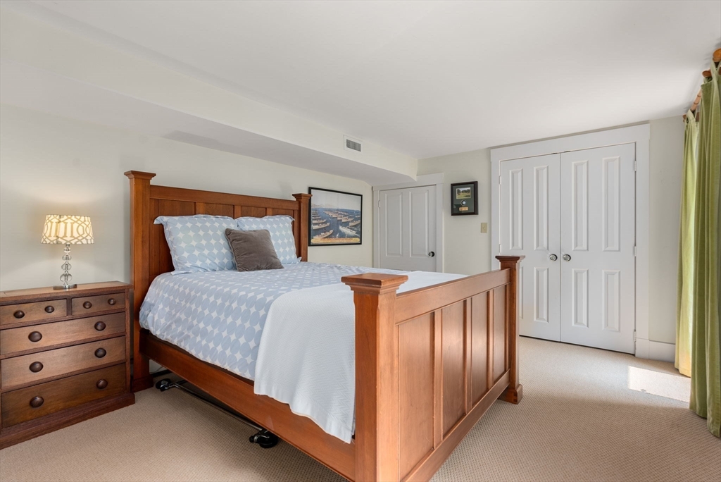 32 Intervale Road Weston, MA 02493 - Photo 31 of 42 a bedroom with a bed and a dresser