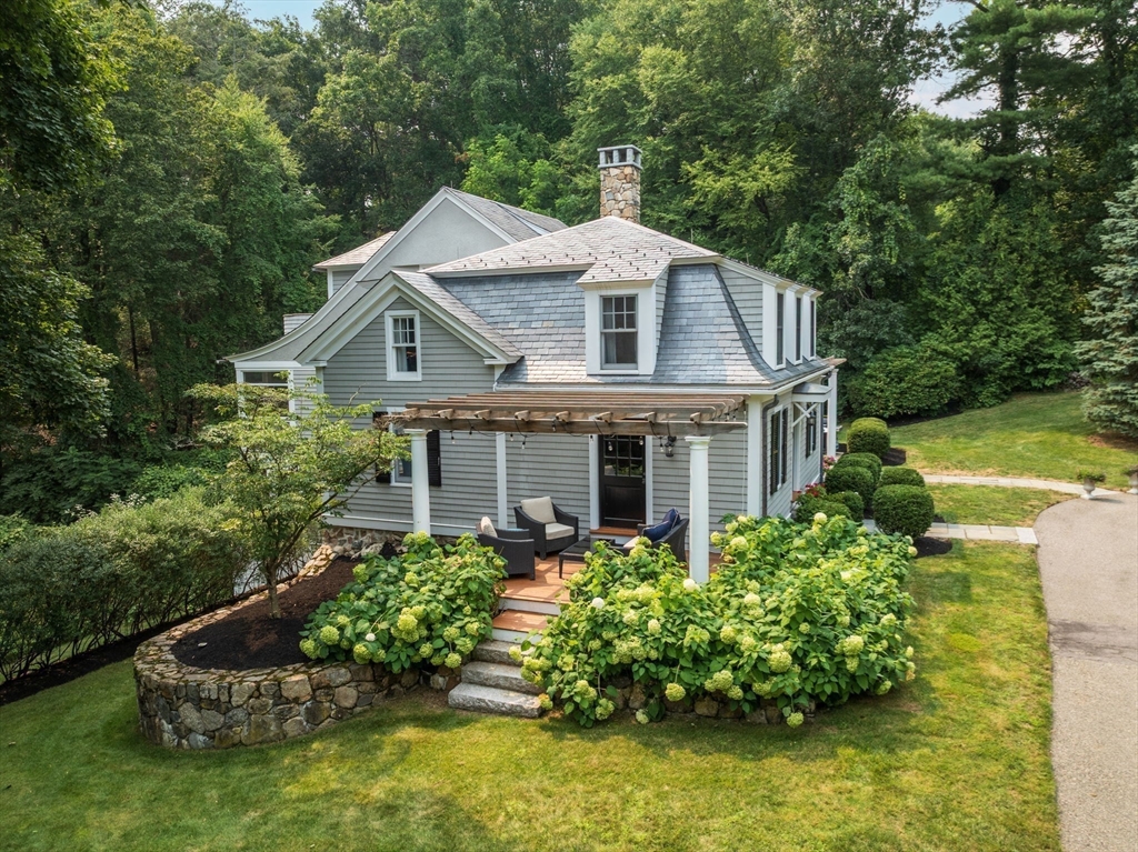 32 Intervale Road Weston, MA 02493 - Photo 35 of 42 a aerial view of a house with swimming pool next to a yard