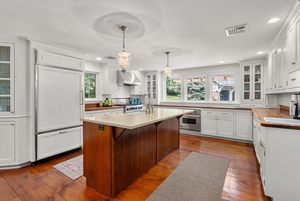32 Intervale Road Weston, MA 02493 - Photo 4 of 42 a kitchen with stainless steel appliances granite countertop a sink a stove and a refrigerator