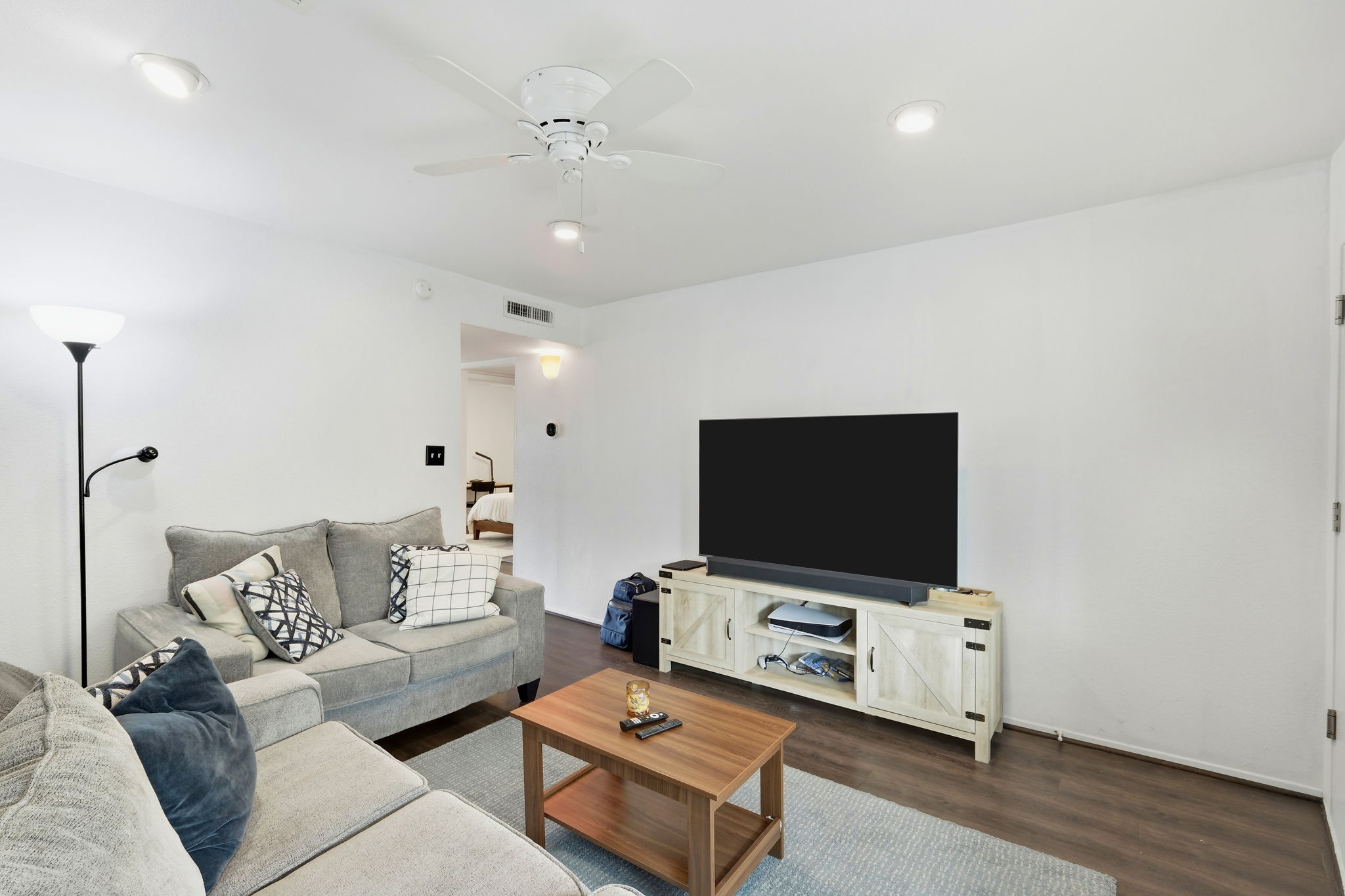 6910 Hart Lane, Unit 912 Austin, TX 78731 - Photo 7 of 36 Living area featuring wood-finish flooring, recessed lighting, and a ceiling fan