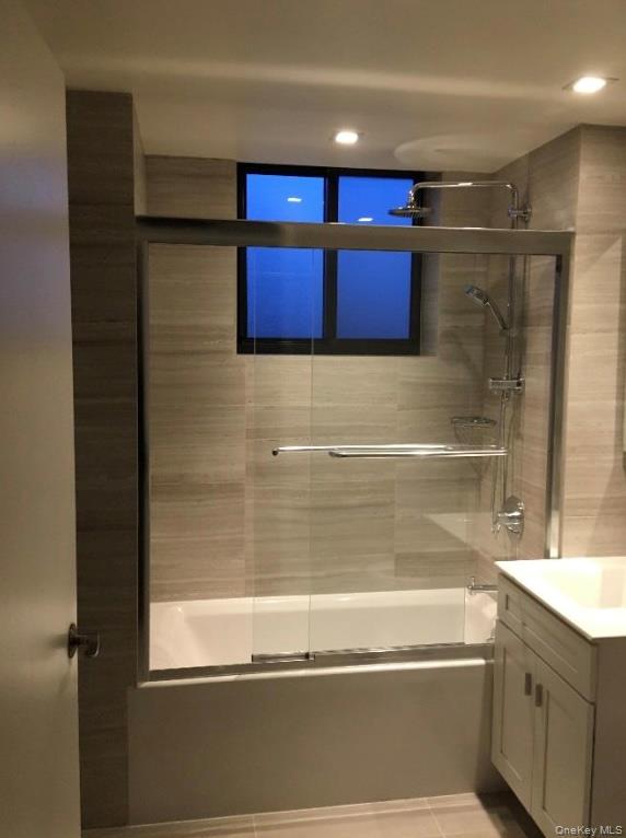 87-22 51st Avenue, Unit 4E Queens, NY 11373 - Photo 14 of 15 a bathroom with a bathtub and a shower