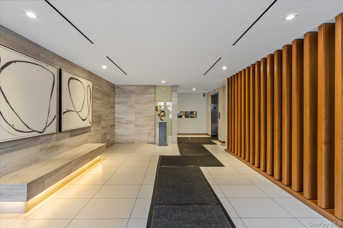 87-22 51st Avenue, Unit 4E Queens, NY 11373 - Photo 4 of 15 a view of a hallway with wooden floor