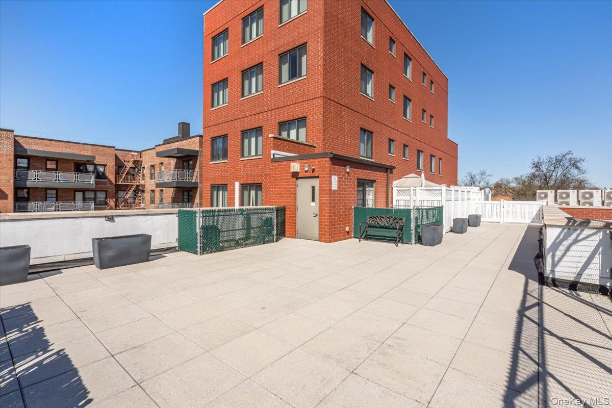 87-22 51st Avenue, Unit 4E Queens, NY 11373 - Photo 9 of 15 a view of a building with a bench