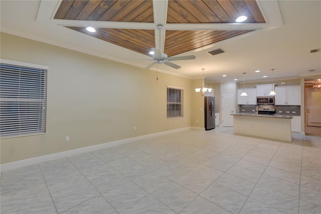 7408 Ridgelake Circle Bradenton, FL 34203 - Photo 19 of 39 a view of an empty room with a kitchen