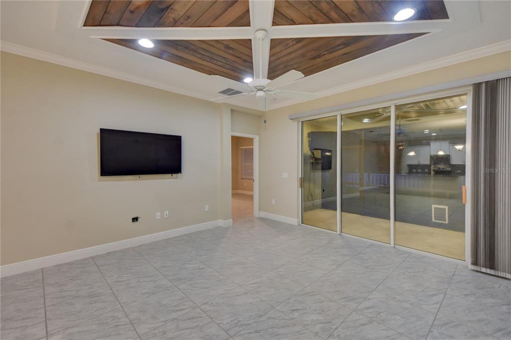 7408 Ridgelake Circle Bradenton, FL 34203 - Photo 20 of 39 a view of an empty room with a flat screen tv