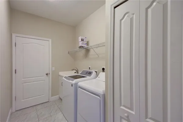 a utility room with dryer and washer
