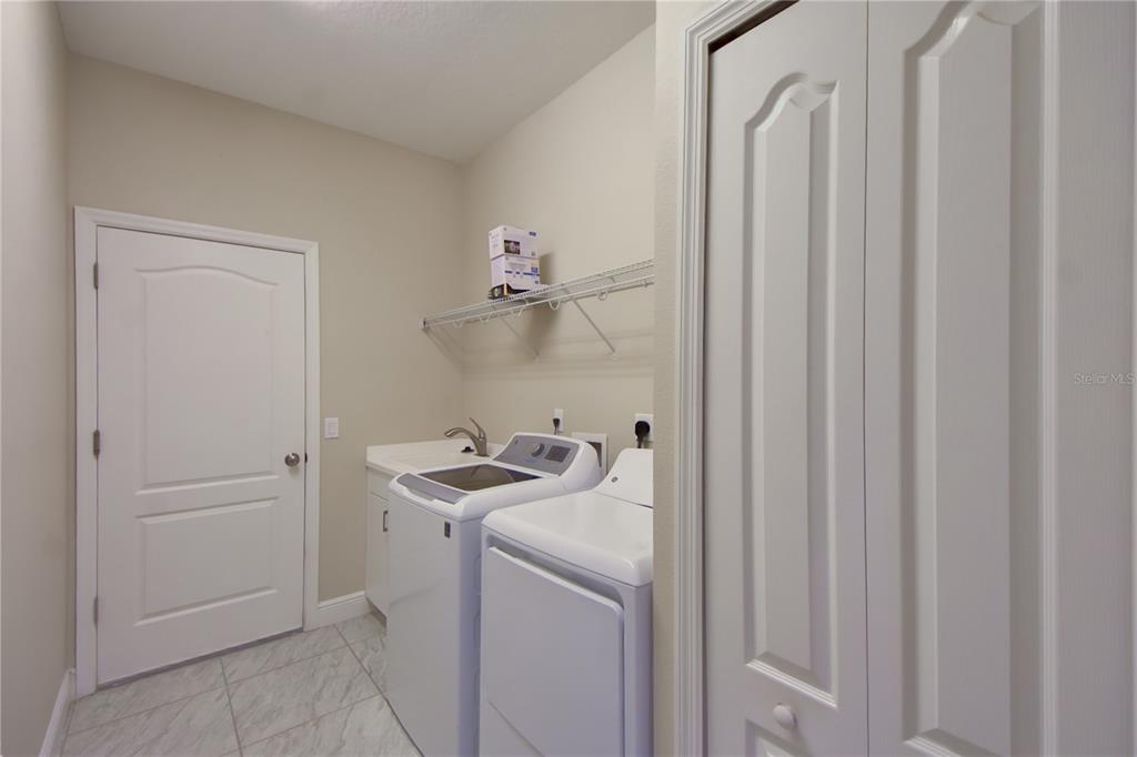 7408 Ridgelake Circle Bradenton, FL 34203 - Photo 22 of 39 a utility room with dryer and washer