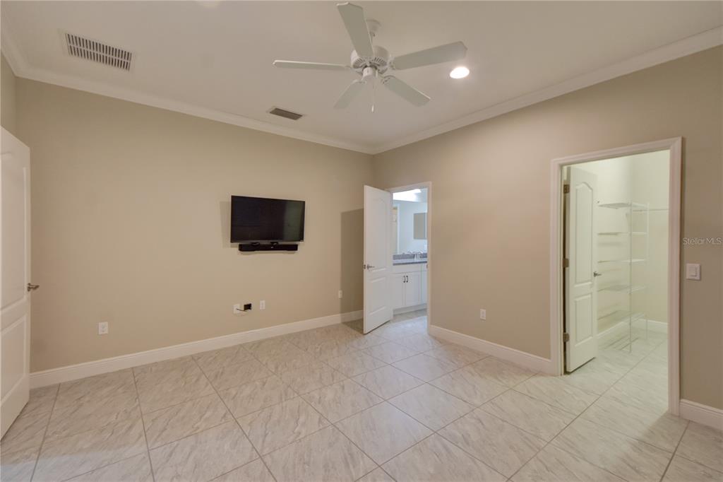 7408 Ridgelake Circle Bradenton, FL 34203 - Photo 23 of 39 an empty room with windows and fan