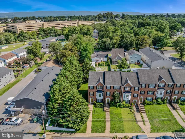 an aerial view of a house with a garden