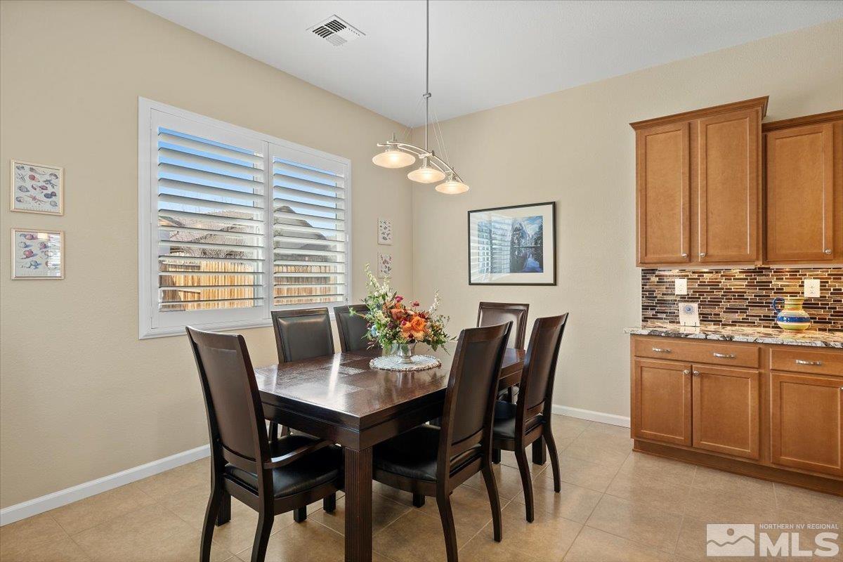 2300 Arpagos Lane Reno, NV 89521 - Photo 14 of 40 a dining room with furniture and window
