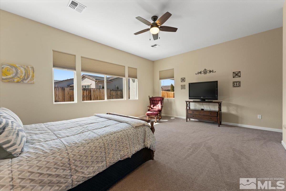 2300 Arpagos Lane Reno, NV 89521 - Photo 16 of 40 a bedroom with bed tv and table
