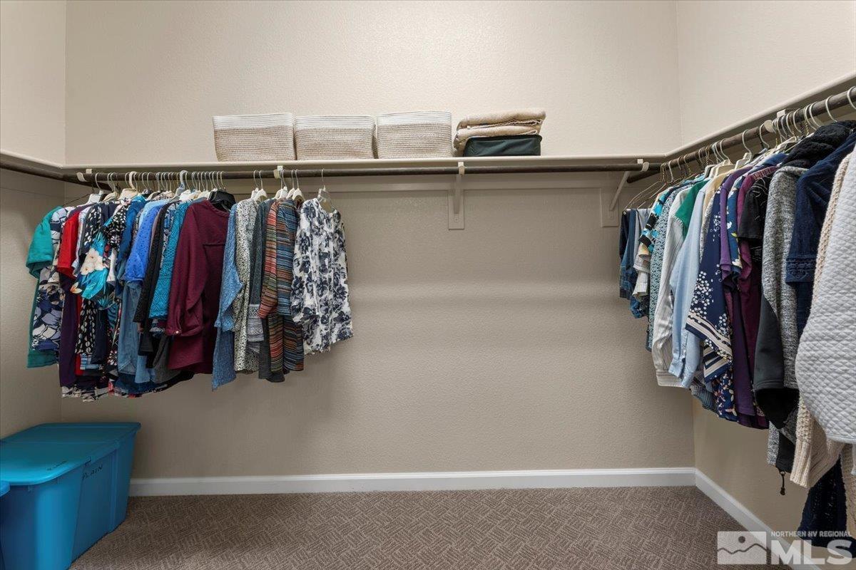 2300 Arpagos Lane Reno, NV 89521 - Photo 18 of 40 a view of walk in closet with clothes and shoes