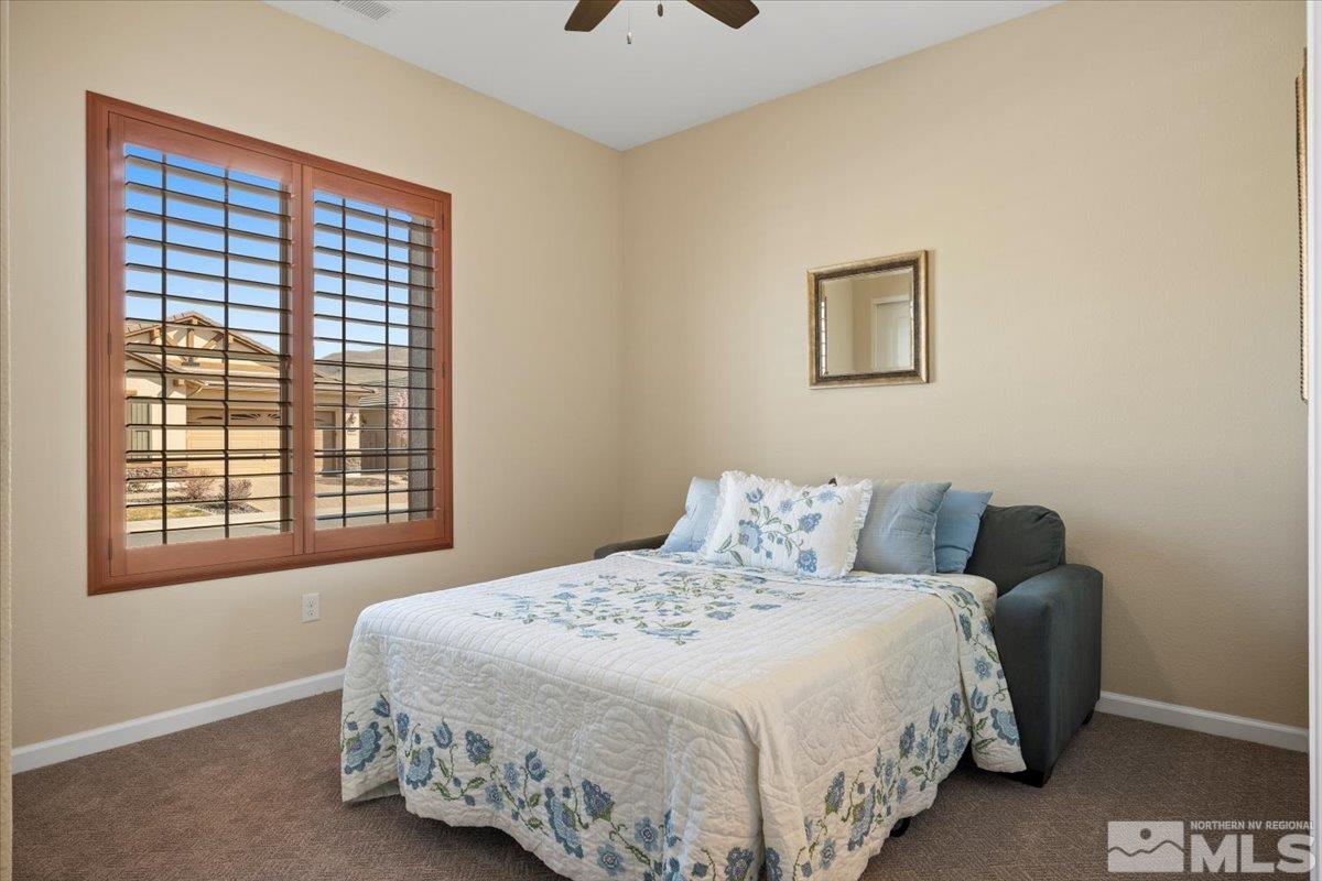 2300 Arpagos Lane Reno, NV 89521 - Photo 19 of 40 a bedroom with a bed and a window