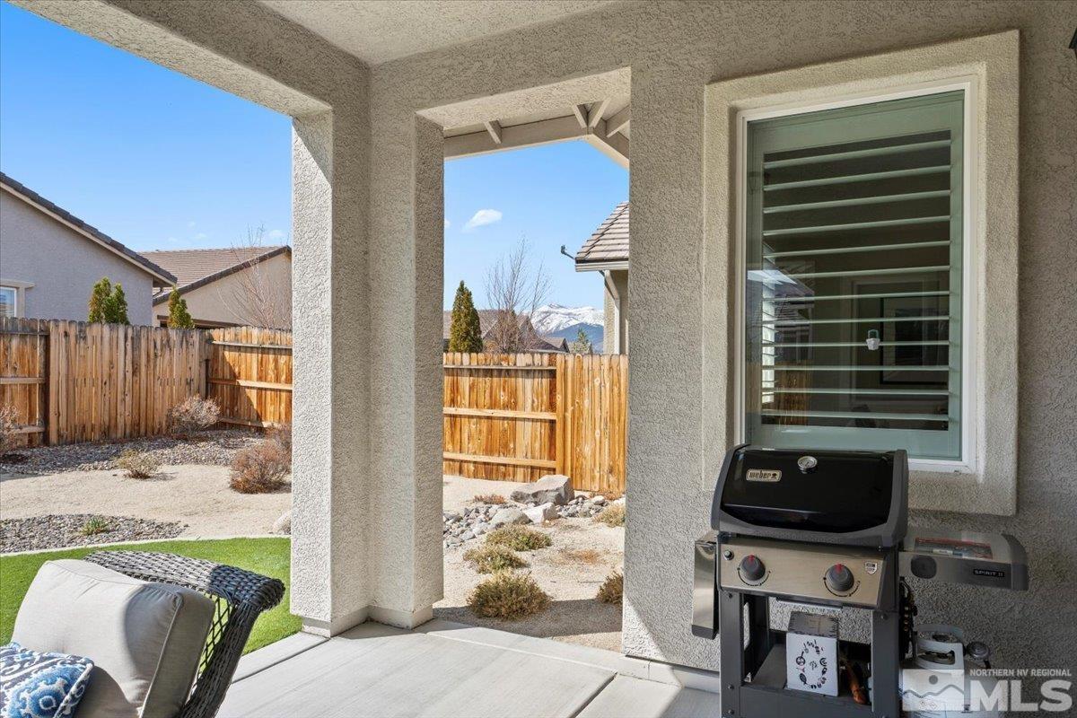 2300 Arpagos Lane Reno, NV 89521 - Photo 26 of 40 a view of a balcony and a dining table and chairs