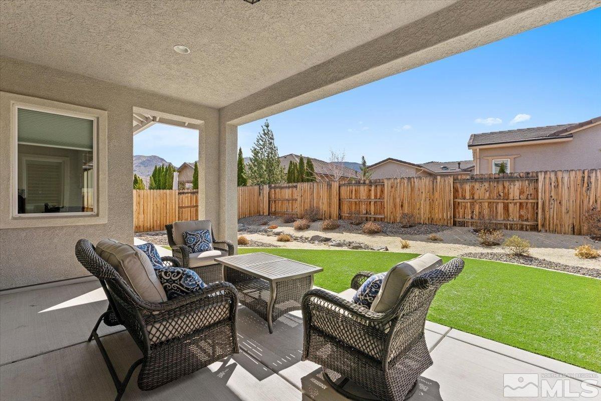 2300 Arpagos Lane Reno, NV 89521 - Photo 27 of 40 a building outdoor space with patio furniture