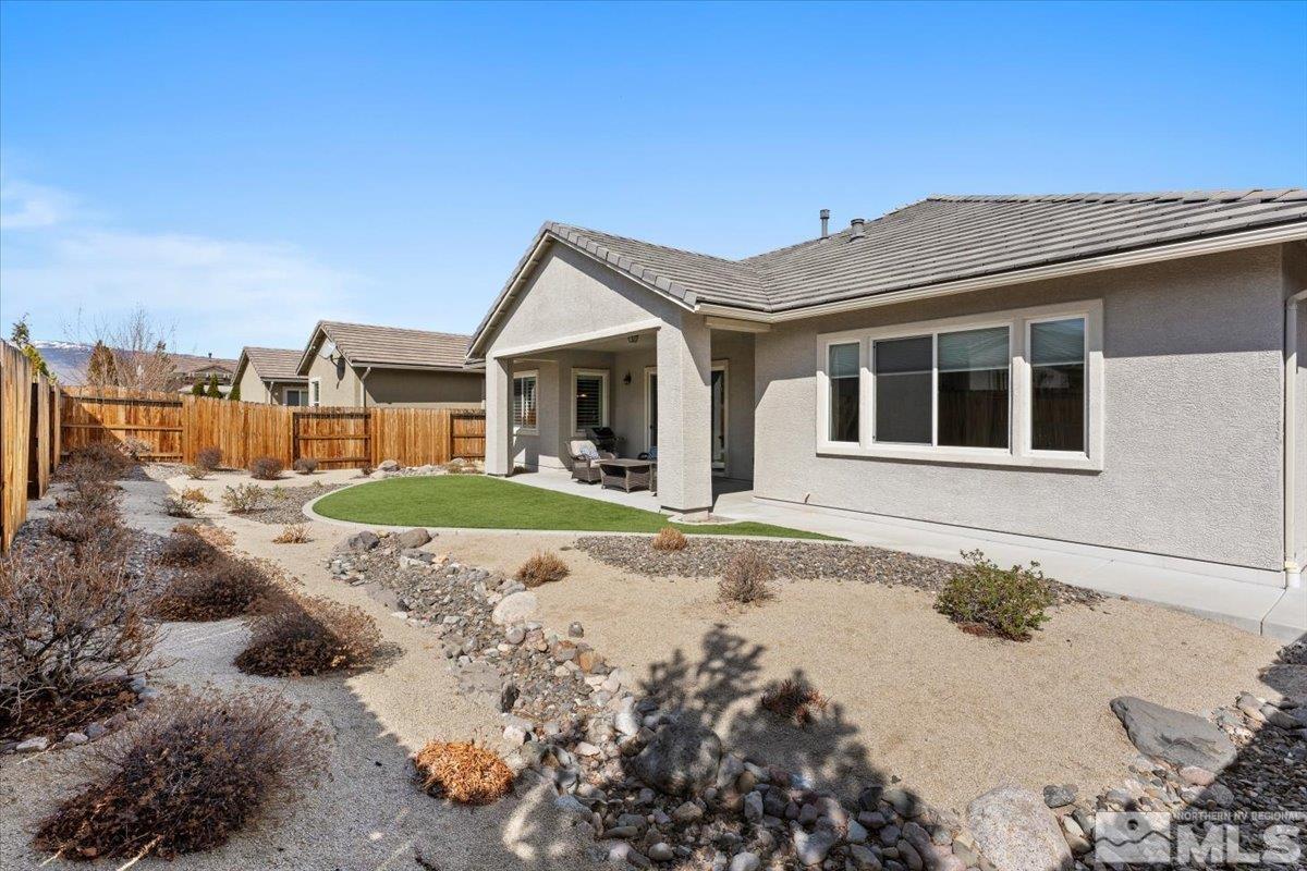 2300 Arpagos Lane Reno, NV 89521 - Photo 29 of 40 a view of a house with a yard