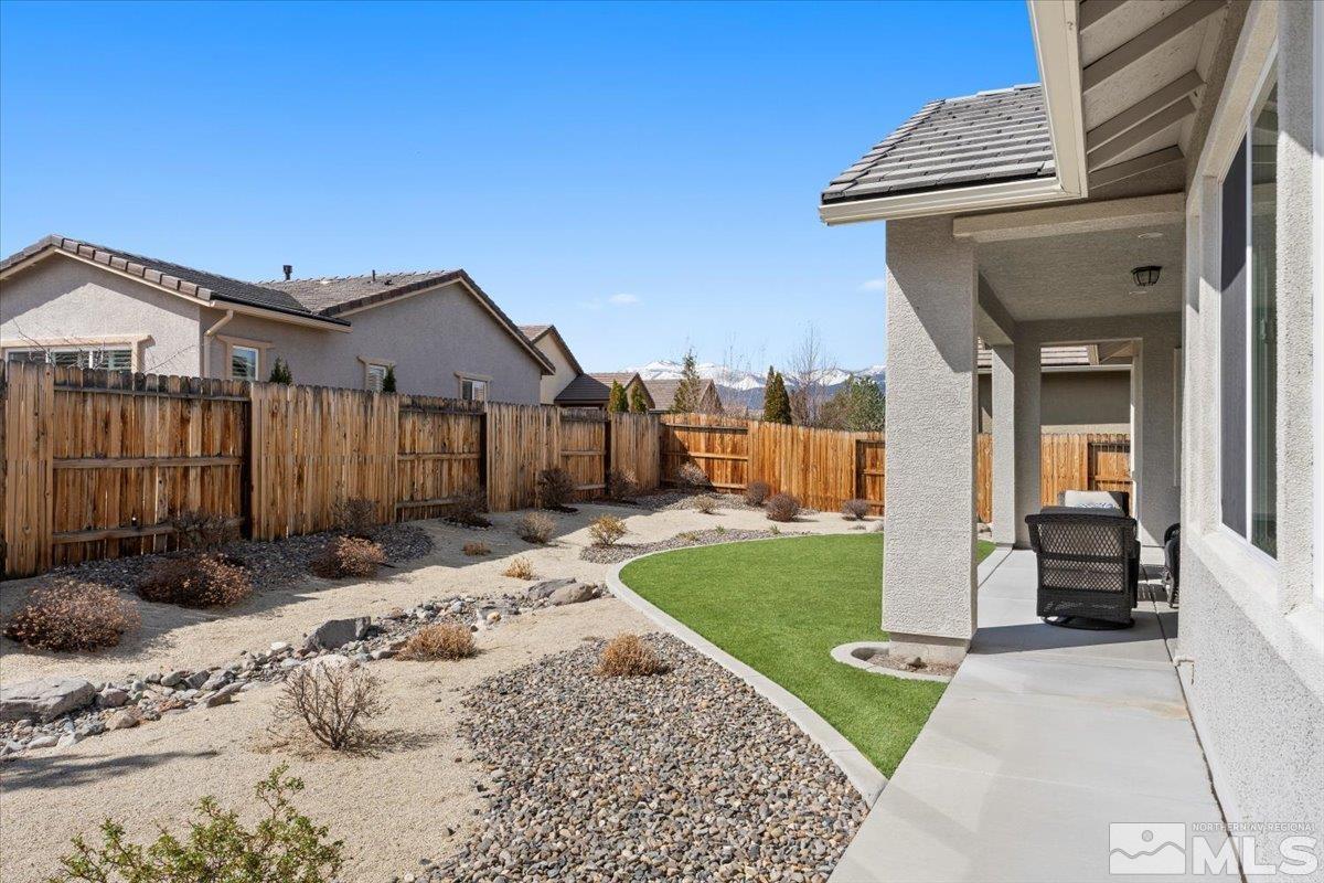 2300 Arpagos Lane Reno, NV 89521 - Photo 30 of 40 a view of a house with a yard