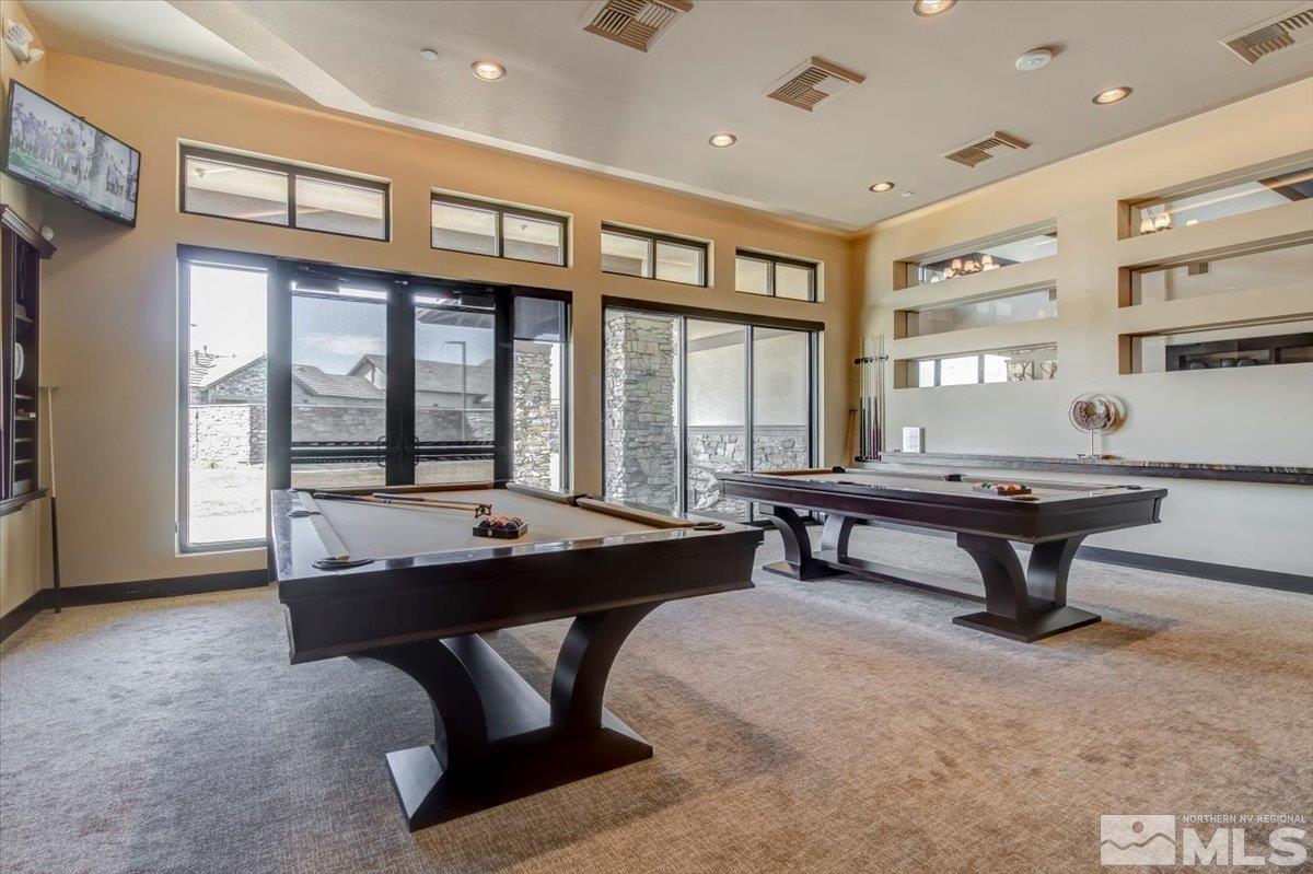 2300 Arpagos Lane Reno, NV 89521 - Photo 36 of 40 a living room with furniture a pool table and a large window