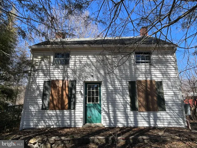 a front view of a house with garage