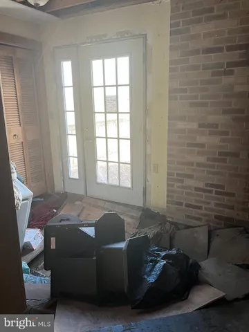 a kitchen with a sink cabinets and a window
