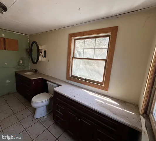a bathroom with a tub and sink