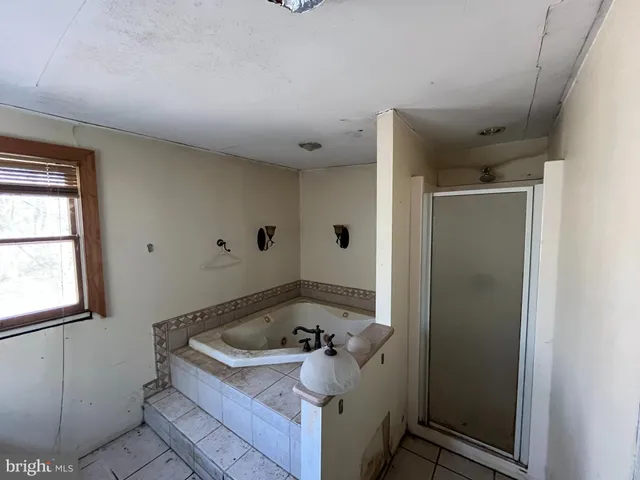 a bathroom with a toilet a sink and a mirror