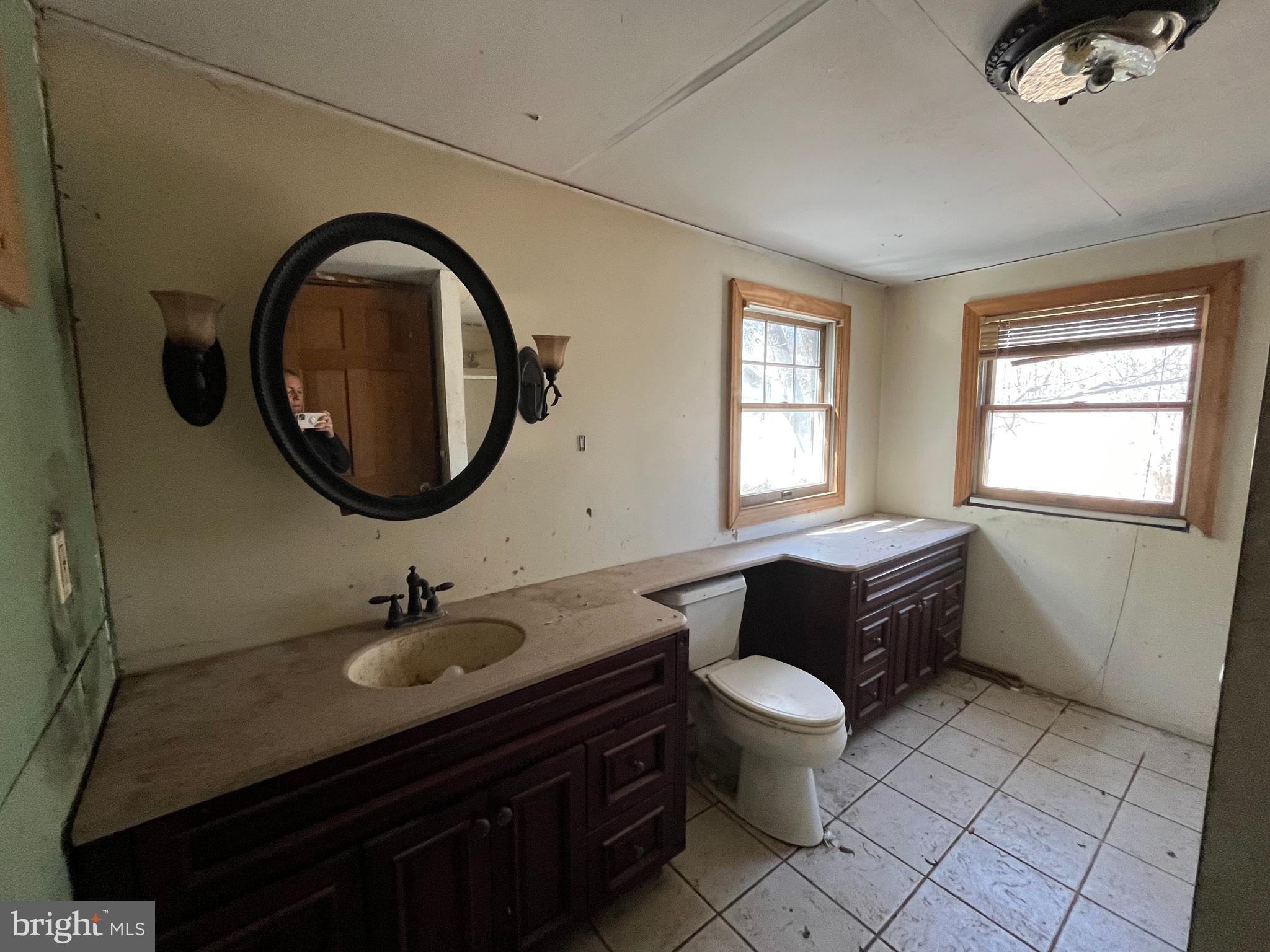 1165 Apple Road Quakertown, PA 18951 - Photo 26 of 46 a bathroom with a toilet a sink and a mirror