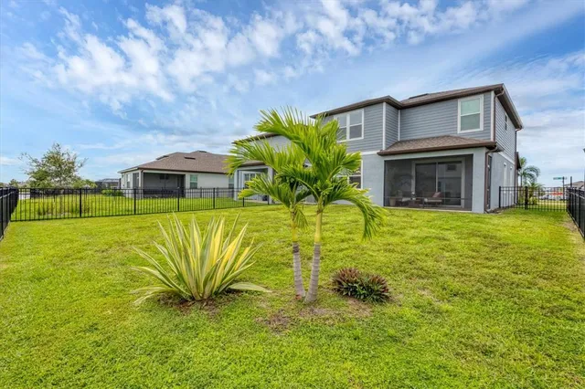 a house view with swimming pool in front of it