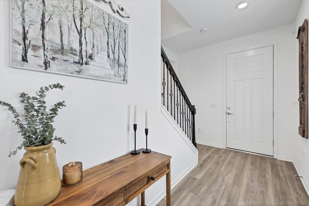 9528 Lamine Way Parrish, FL 34219 - Photo 14 of 58 a view of entryway and hall with wooden floor