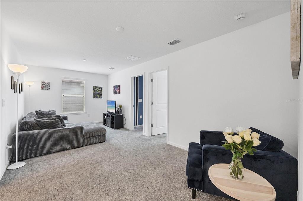 9528 Lamine Way Parrish, FL 34219 - Photo 15 of 58 a living room with furniture and a lamp