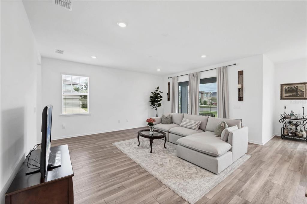 9528 Lamine Way Parrish, FL 34219 - Photo 17 of 58 a living room with furniture and wooden floor