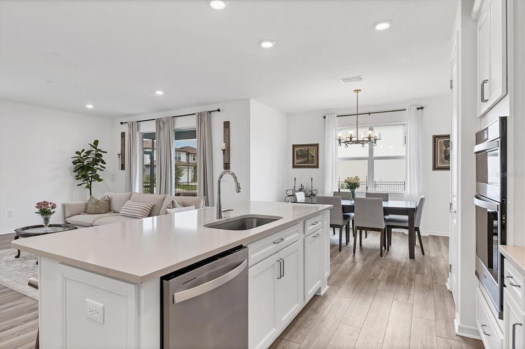 9528 Lamine Way Parrish, FL 34219 - Photo 20 of 58 a kitchen with sink and refrigerator