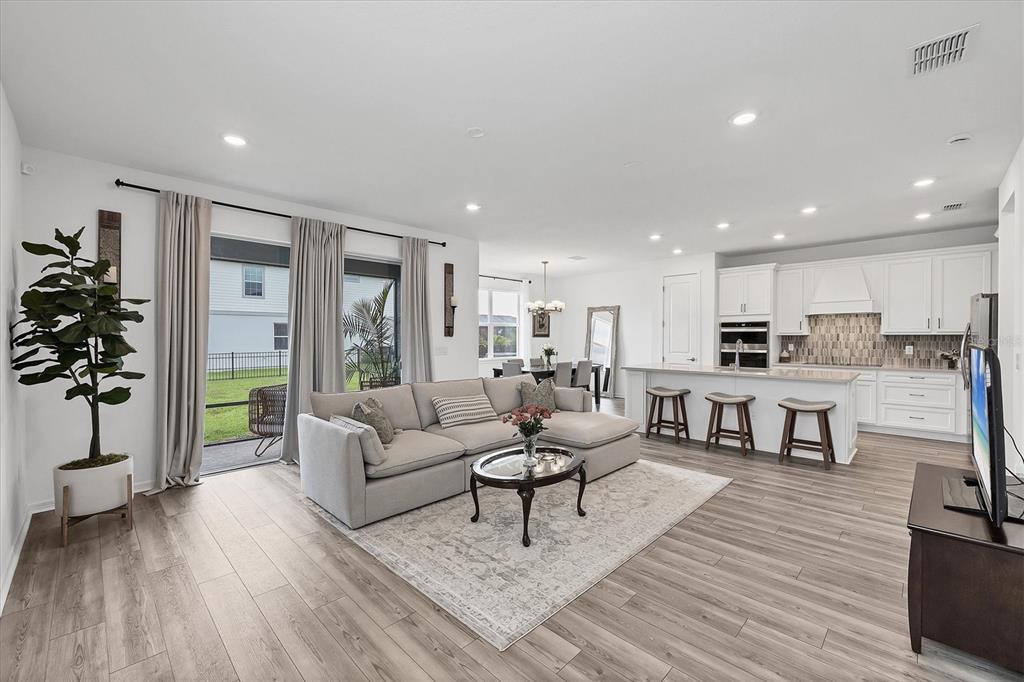 9528 Lamine Way Parrish, FL 34219 - Photo 2 of 58 a living room with furniture and a table
