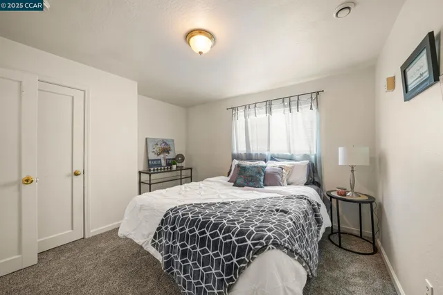 a bedroom with a bed and a cabinets